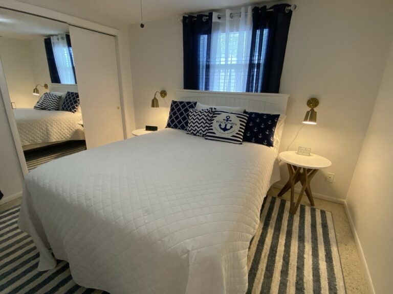 Queen bed with new mattress and linens